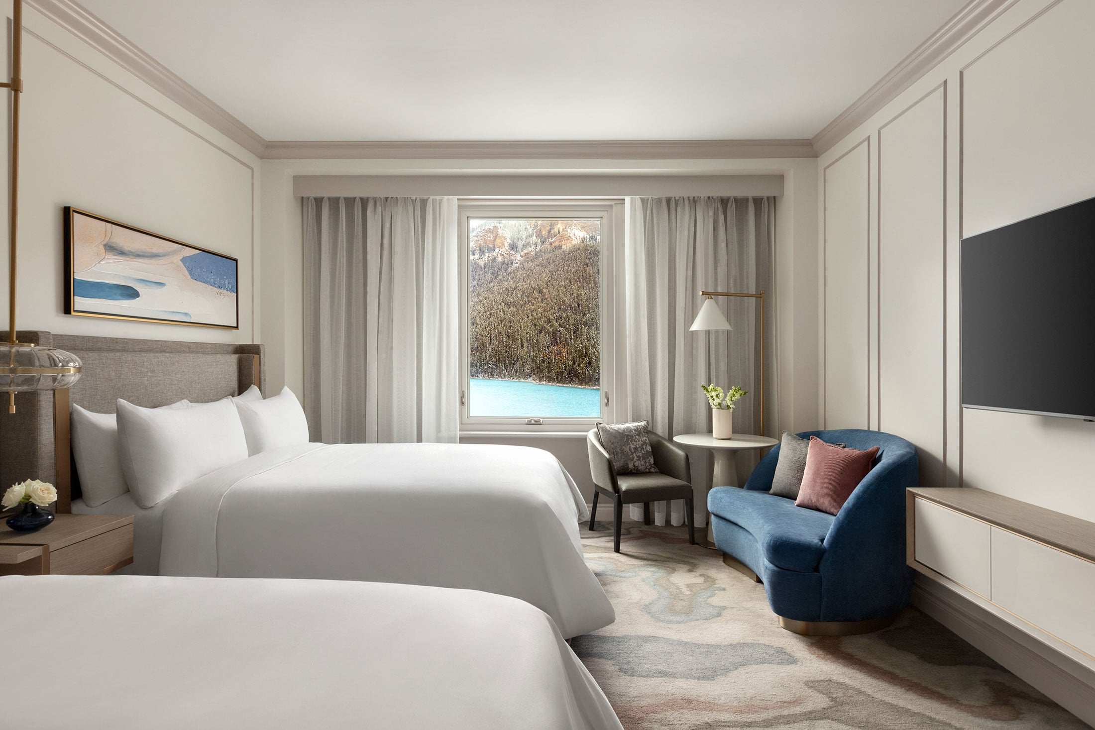 Guest room with two beds and a lake-facing window, Lake Louise, Canada