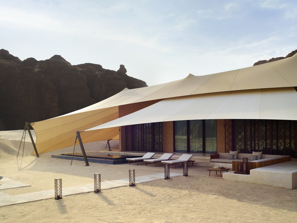 Private villa pool and shaded terrace facing sandstone formations at Banyan Tree AlUla.