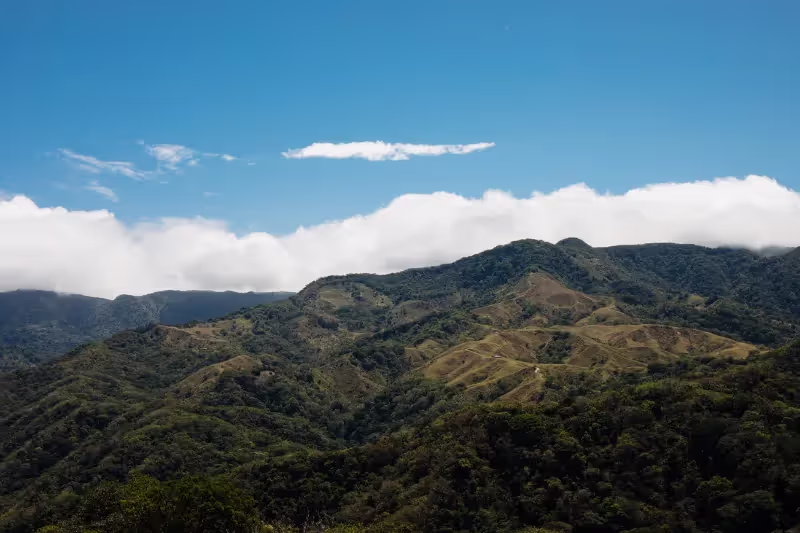 Panoramic view of green mountain ridges under blue skies, Hotel Belmar, Monteverde, Costa Rica