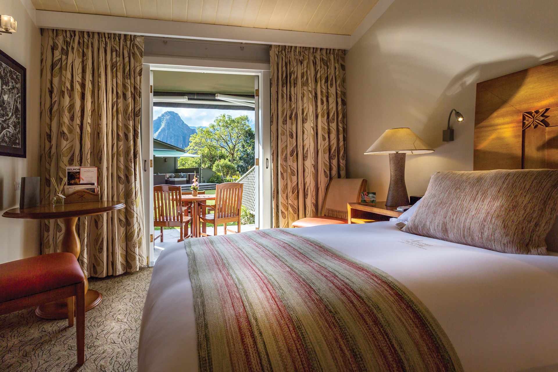 Guest room with a mountain-facing terrace at Belmond Sanctuary Lodge, Machu Picchu, Peru