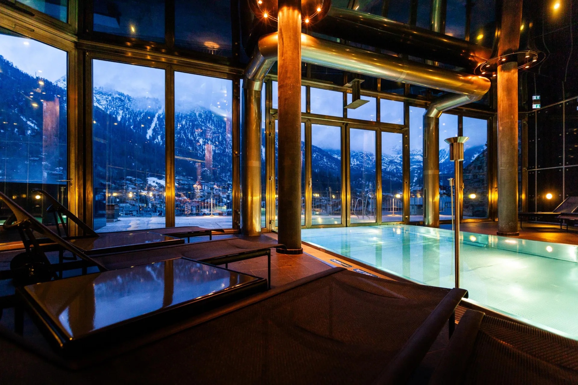Indoor pool with mountain views at night at The Omnia, Zermatt, Switzerland