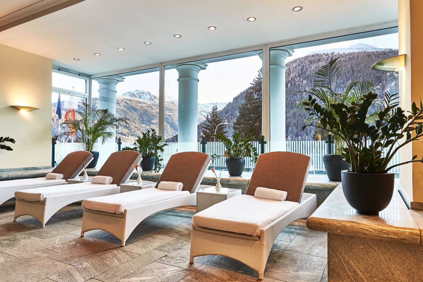 Spa relaxation loungers by panoramic windows, Steigenberger Icon Grandhotel Belvédère, Davos, Switzerland