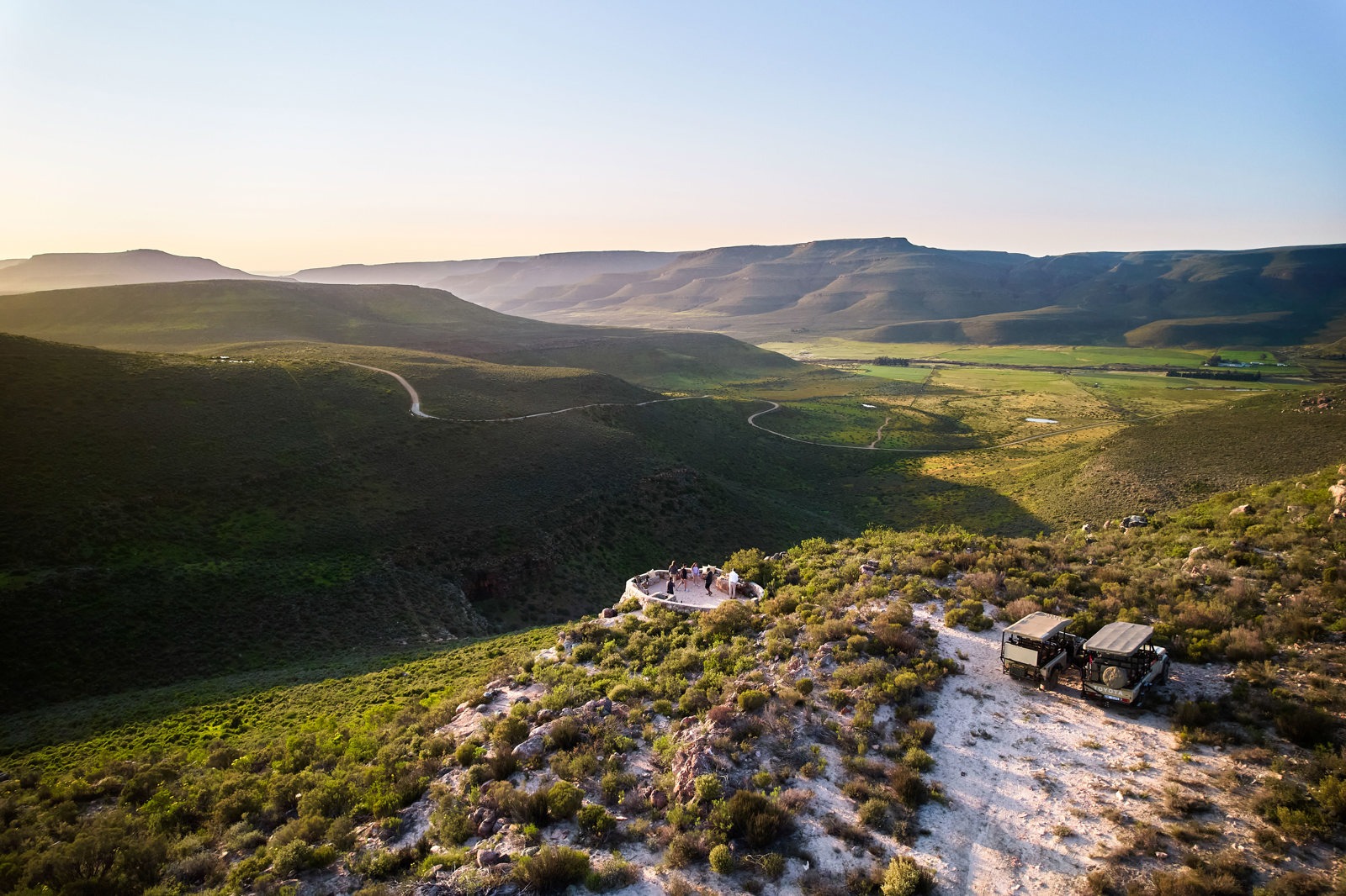 Sunlit mountain and valley view across the reserve, Bushmans Kloof, Cederberg Mountains, Western Cape, South Africa