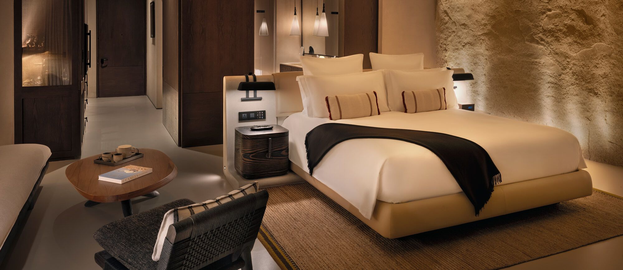 Bedroom of the One-Bedroom Mountain Cave Suite carved into the rock, Desert Rock