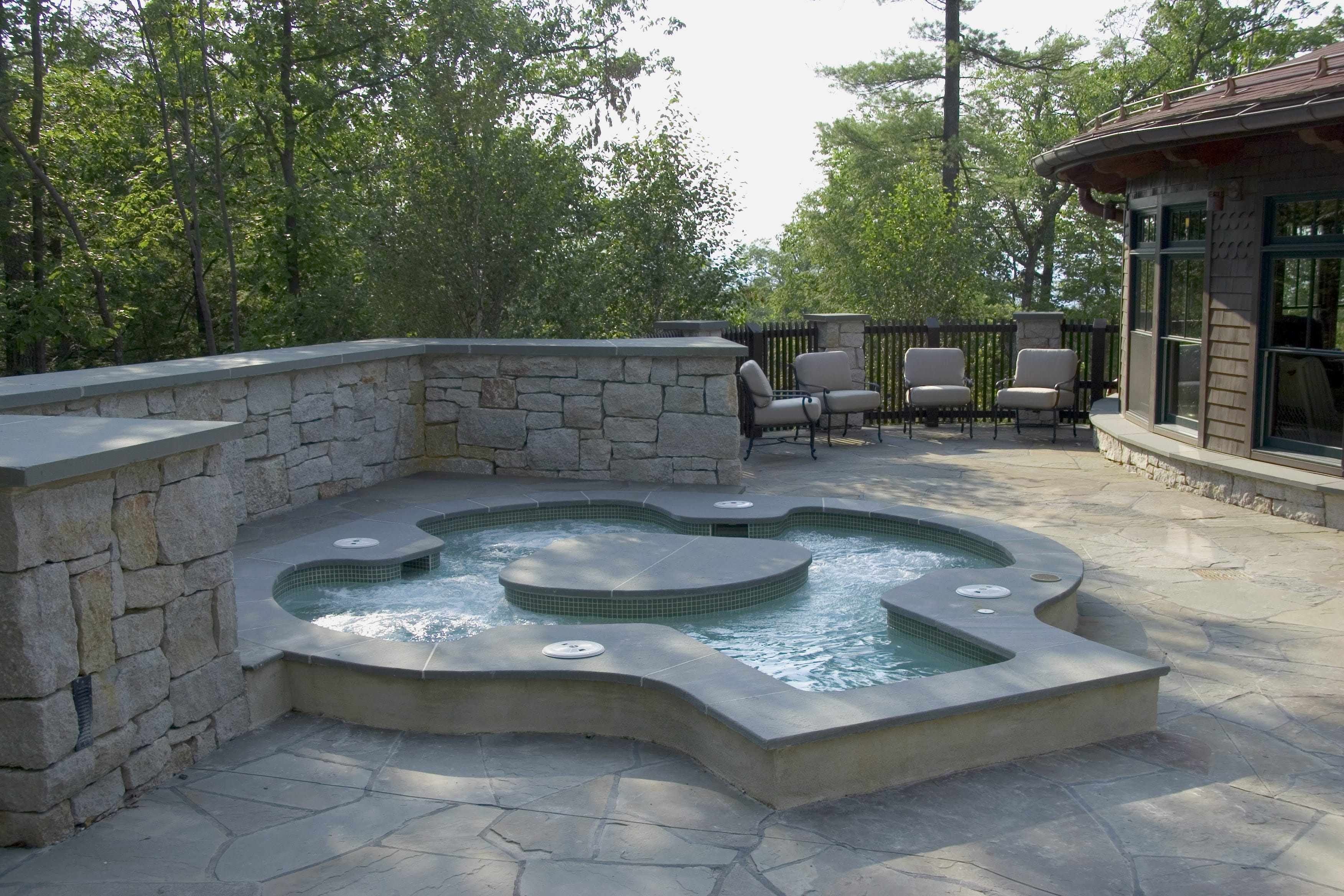 Outdoor spa pool on a stone terrace at Mohonk Mountain House, New Paltz, USA