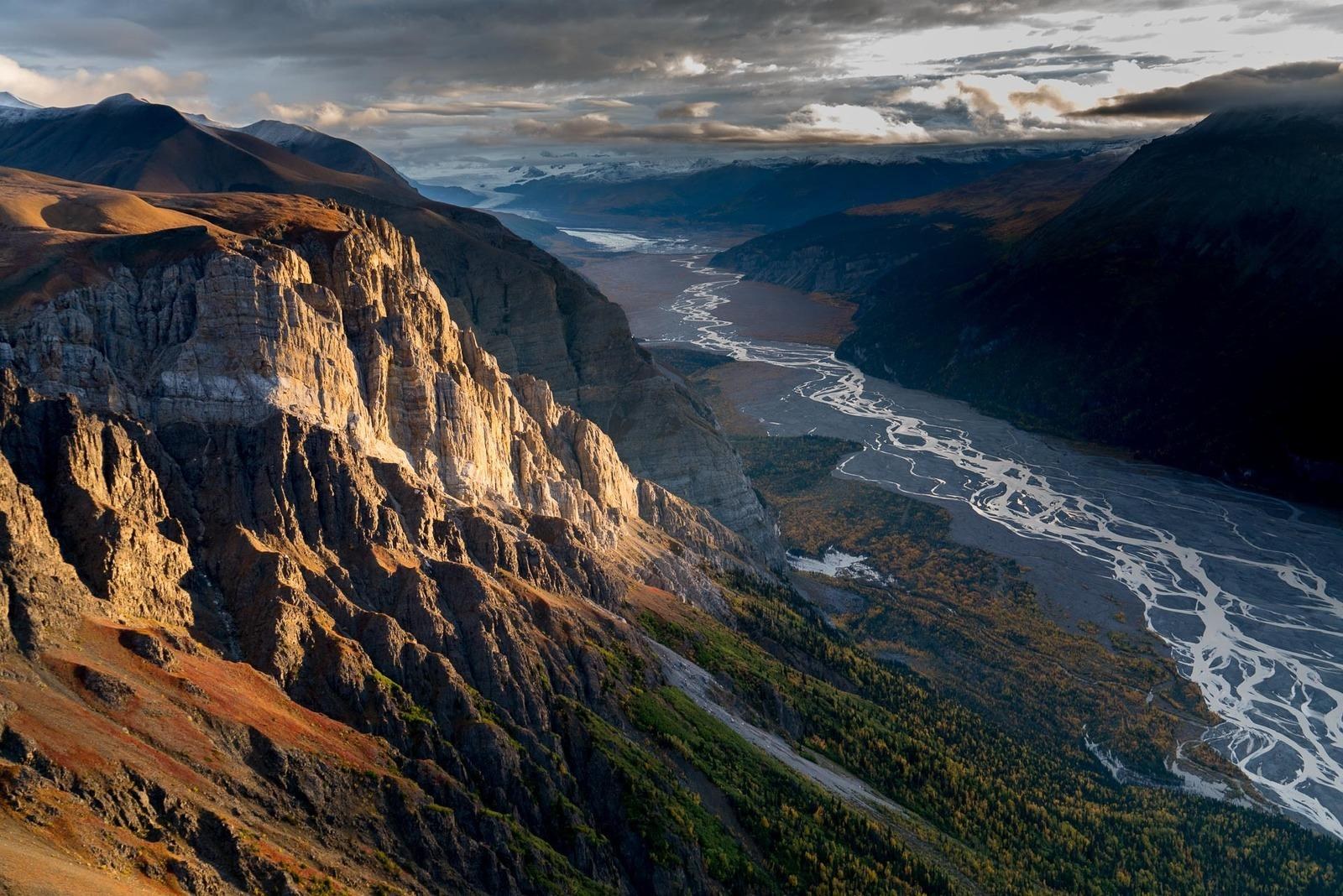 Aerial view of a braided river through a rugged mountain valley, Ultima Thule Lodge, Alaska, USA