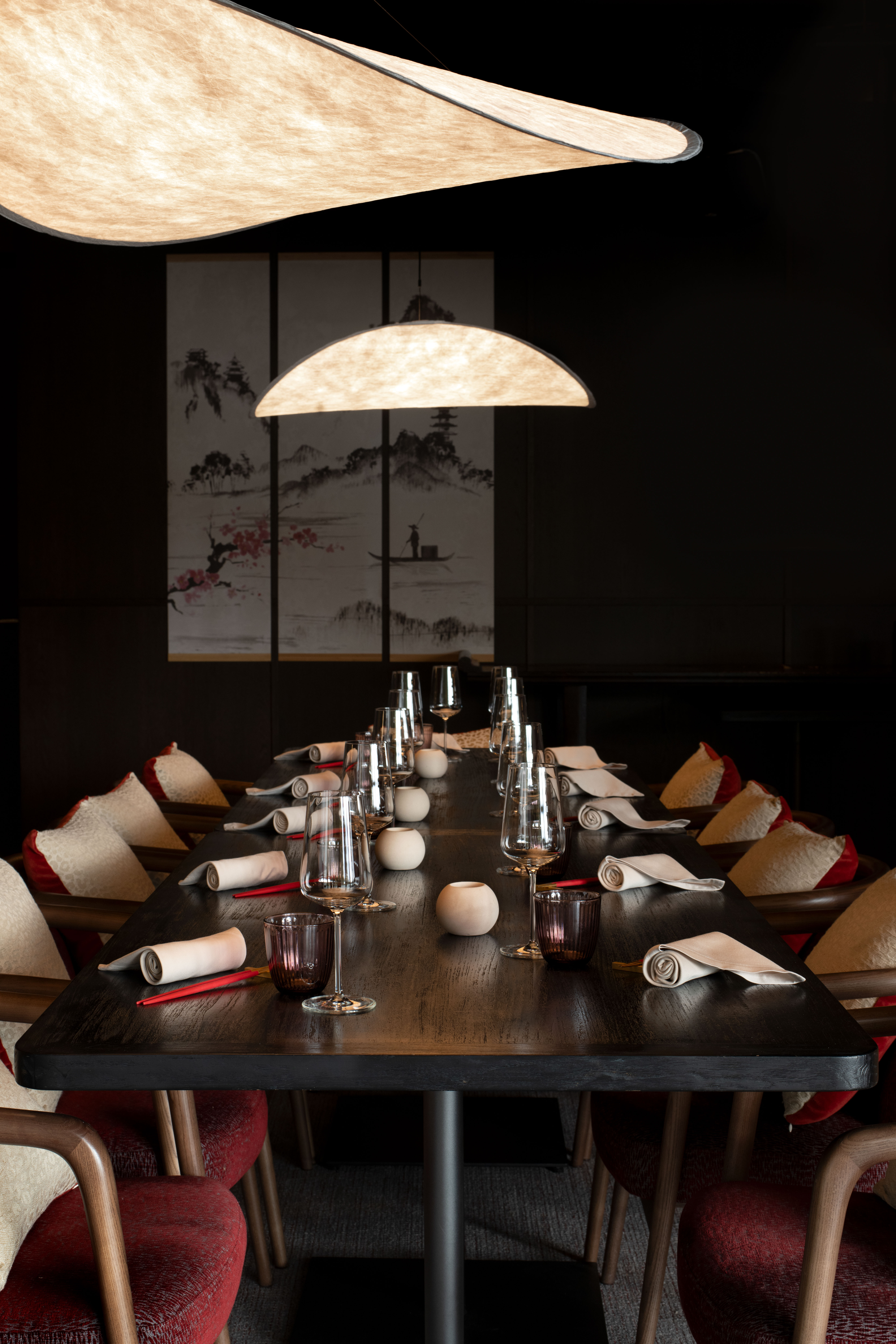 Byakko restaurant dining table beneath sculptural pendant lights, Six Senses Crans-Montana, Crans-Montana, Switzerland