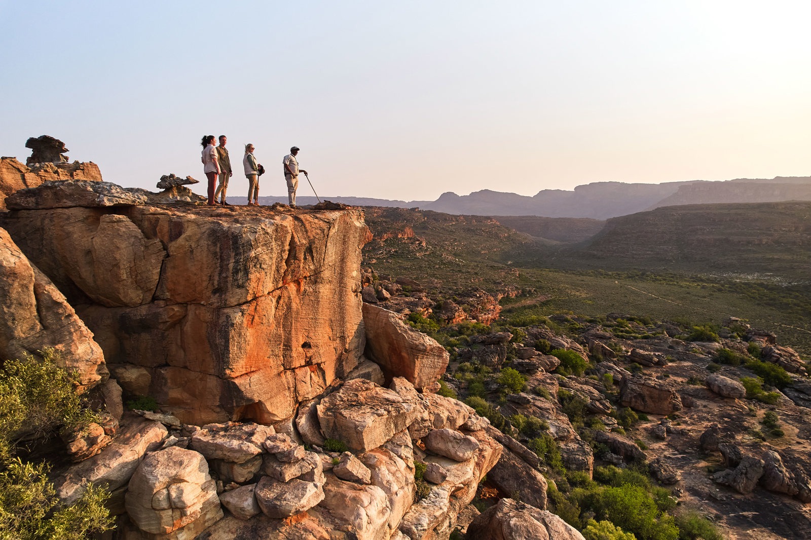 Guided walk on a sandstone ridge above the valley, Bushmans Kloof, Cederberg Mountains, Western Cape, South Africa