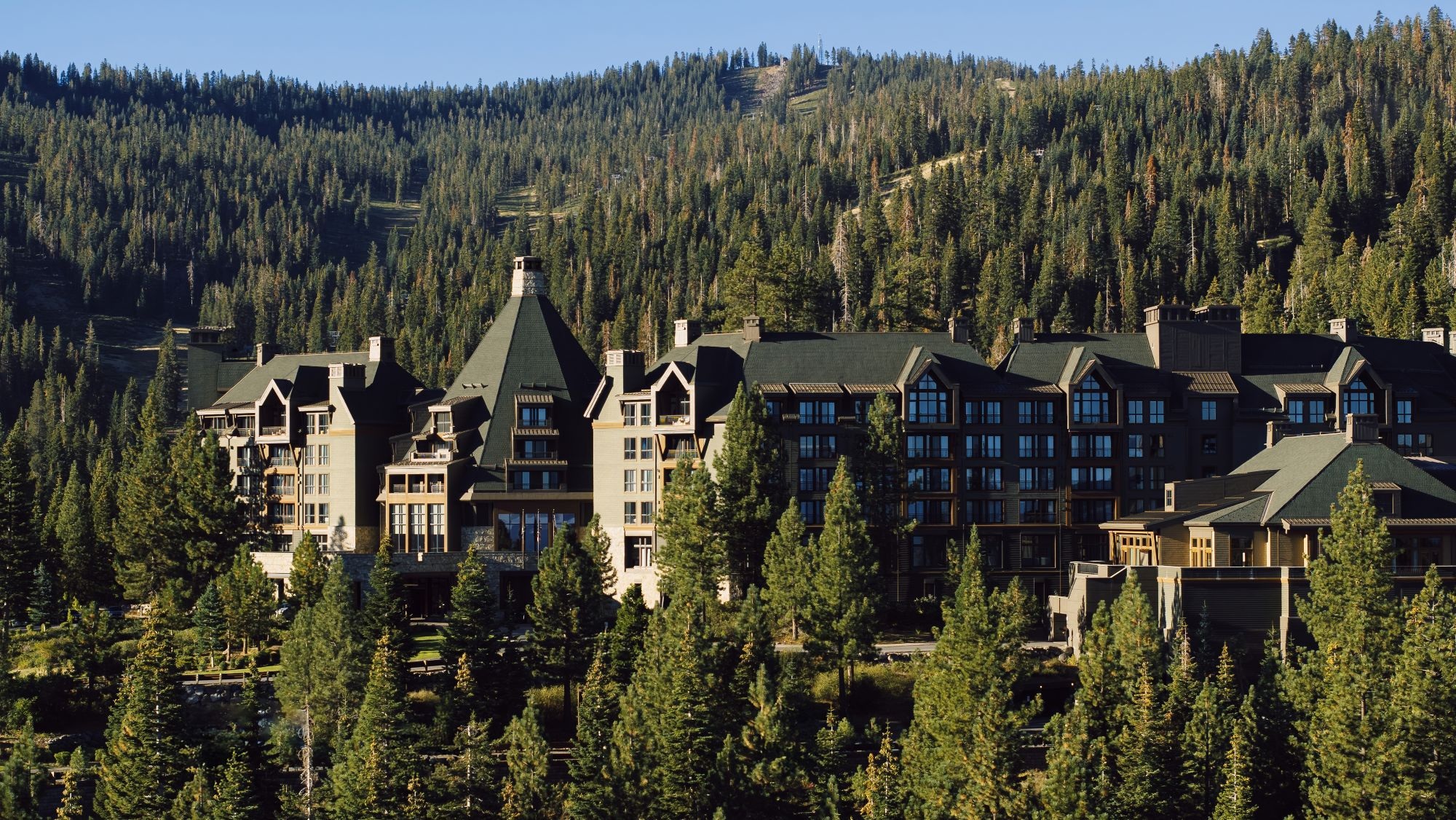 Aerial view of the resort amid forested mountain slopes at The Ritz-Carlton, Lake Tahoe, Northstar, USA