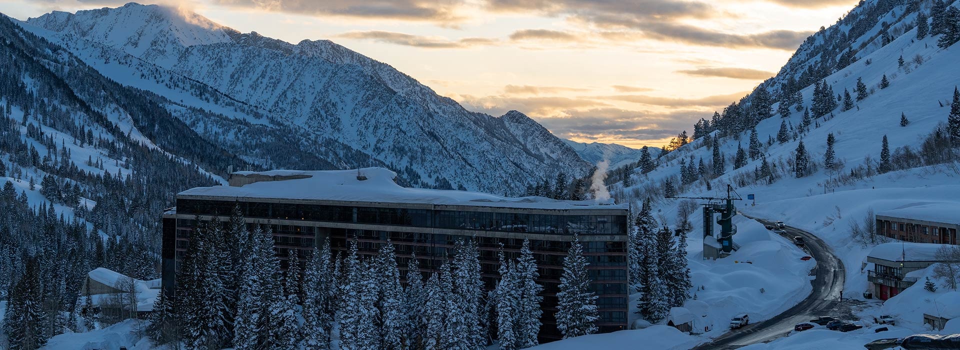 The Cliff Lodge amid snowy mountains at sunset, Snowbird, USA