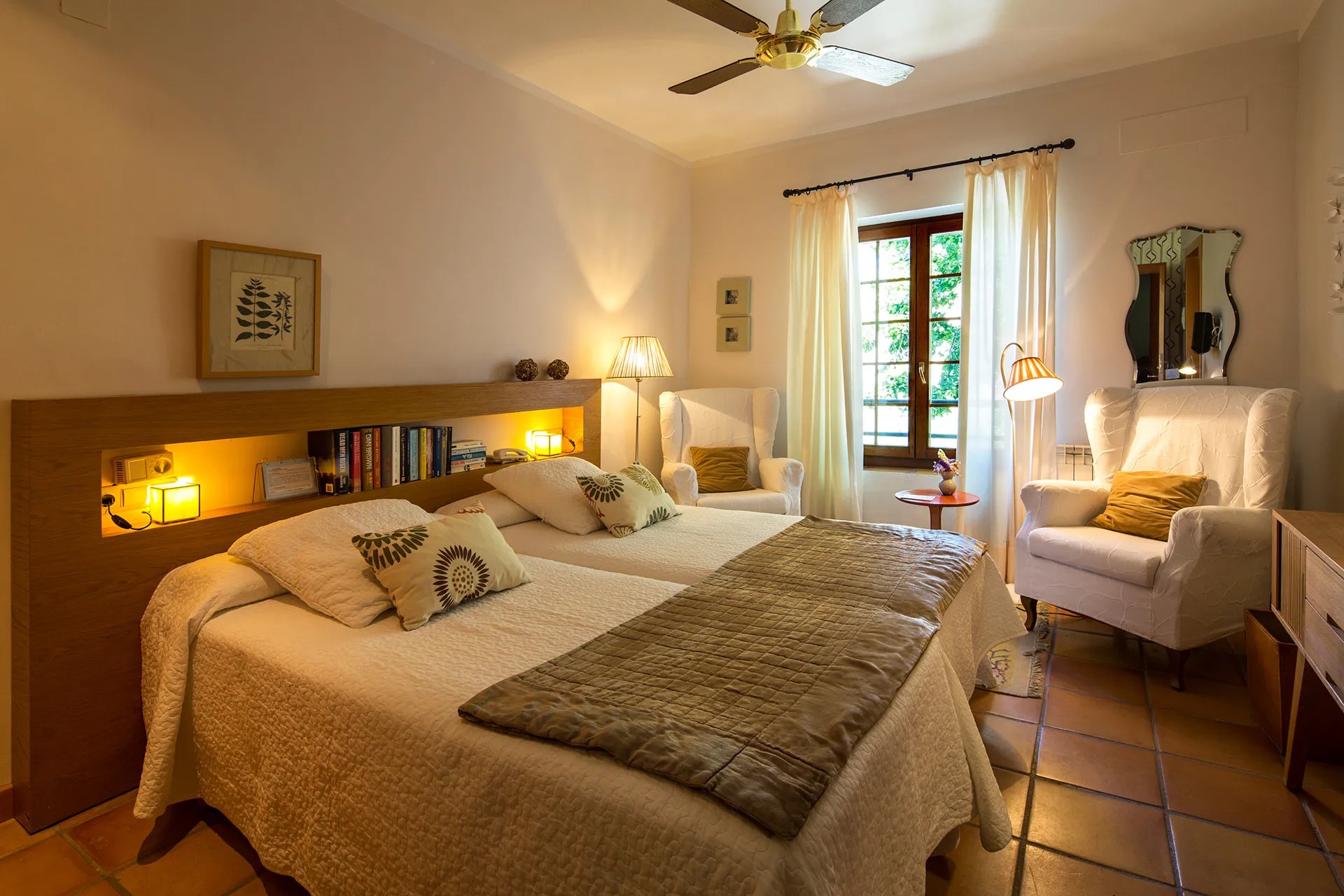 Guest bedroom with twin beds and a balcony doorway at La Almunia del Valle, Monachil, Spain