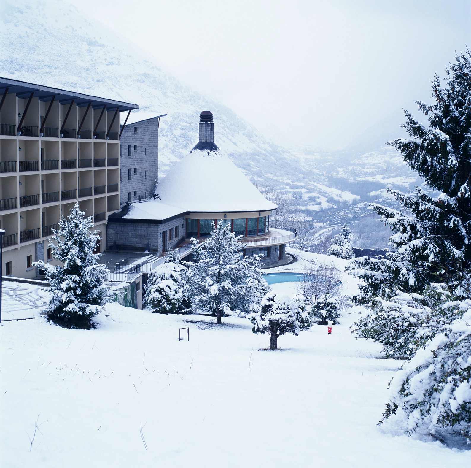 Snow-covered hotel exterior in winter at Parador de Vielha, Vielha, Spain