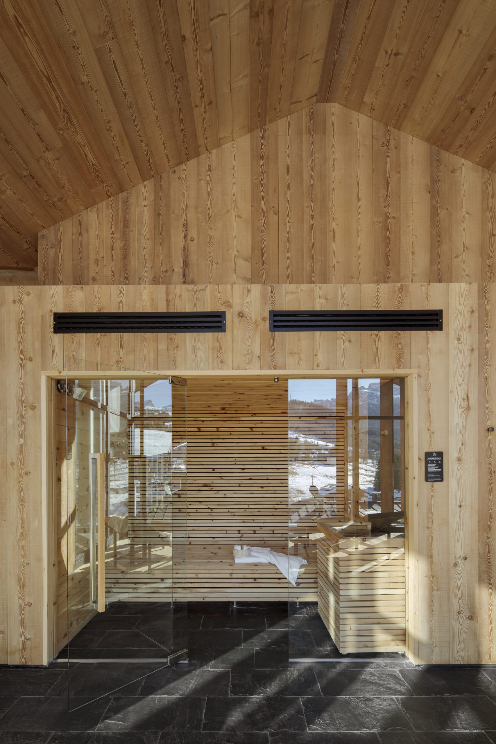 Glass-fronted sauna in the spa, Hotel de Lën, Cortina d’Ampezzo, Italy