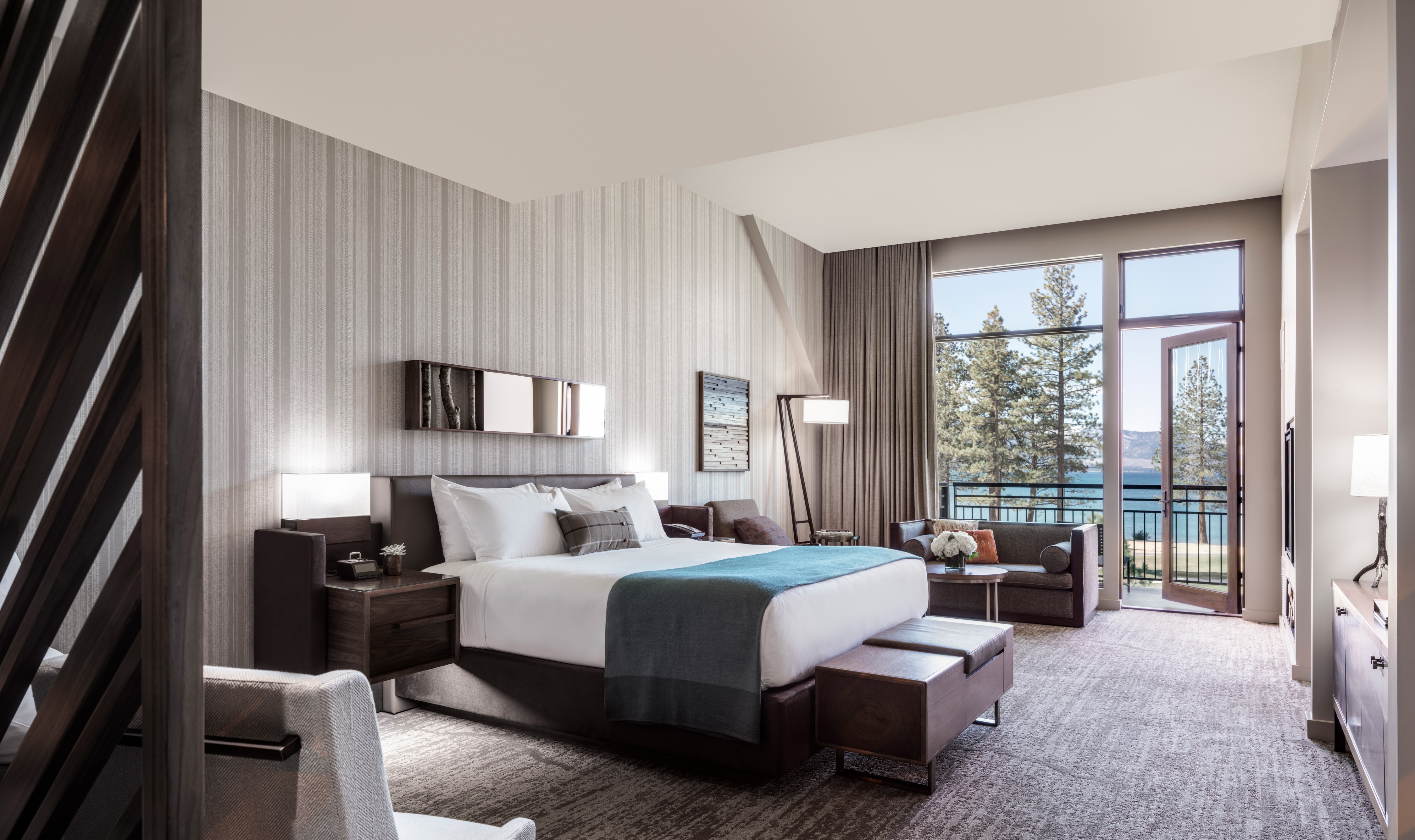 King guestroom with balcony and large windows at Edgewood Tahoe Resort, Stateline, USA