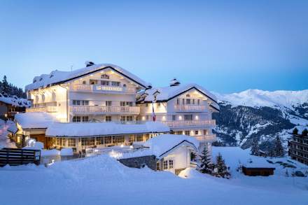 Mountain rooftops beneath the ski slopes